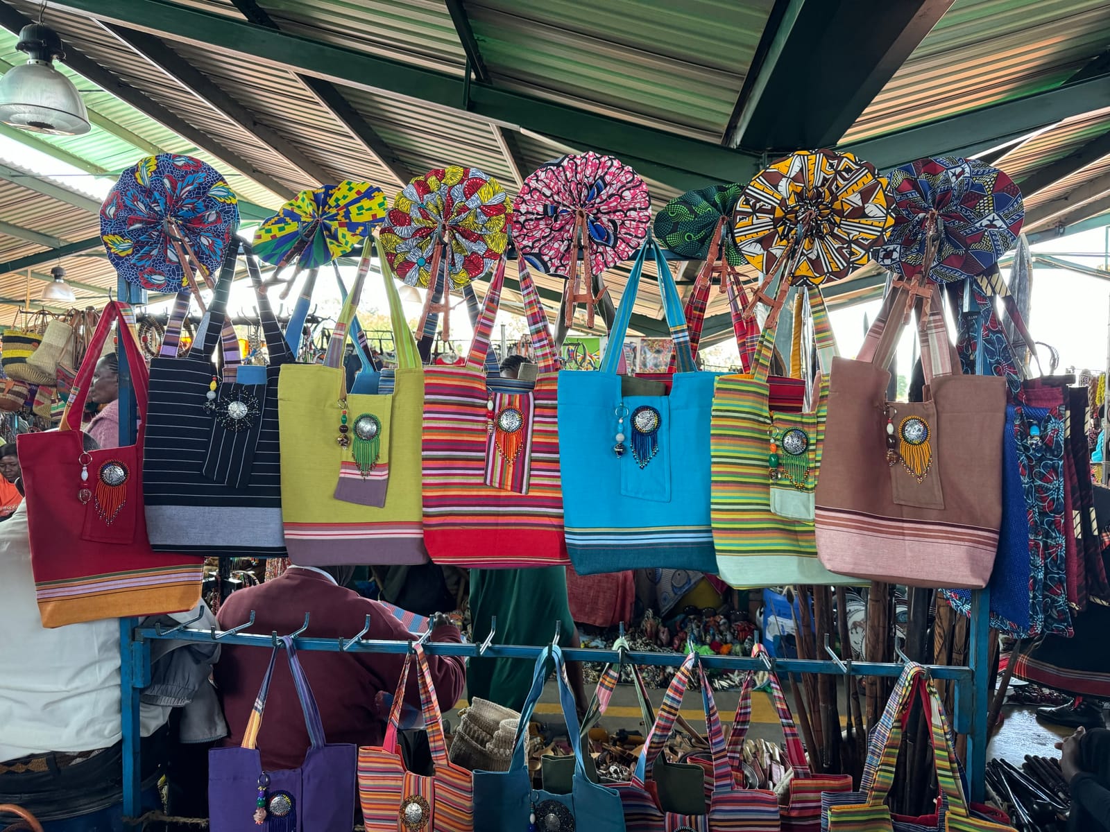Handmade bags and fans on a craft market stall at Village Market, Nairobi (file photo, 2023; not Ankole Luxury products).