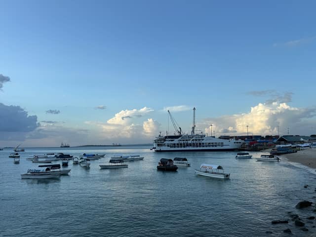 Boats and a ferry moored in the harbour off Mizingani Road, Zanzibar (file photo, 2025).