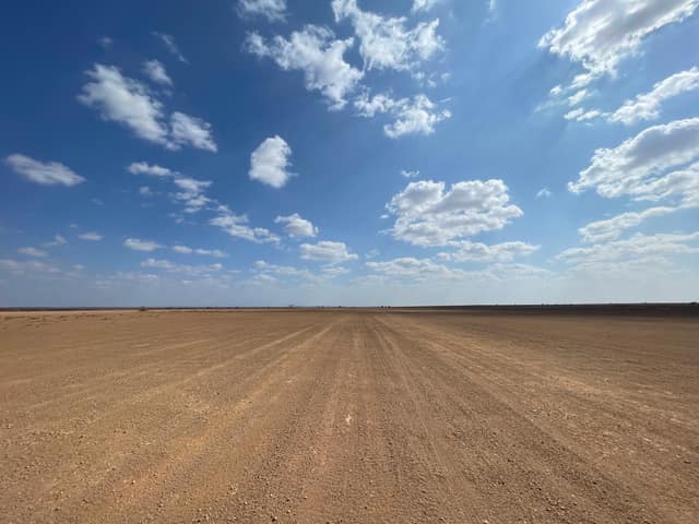 A straight gravel track across the flat desert near North Horr, Marsabit County, northern Kenya (file photo, December 2022; not from Moyale or from this event).