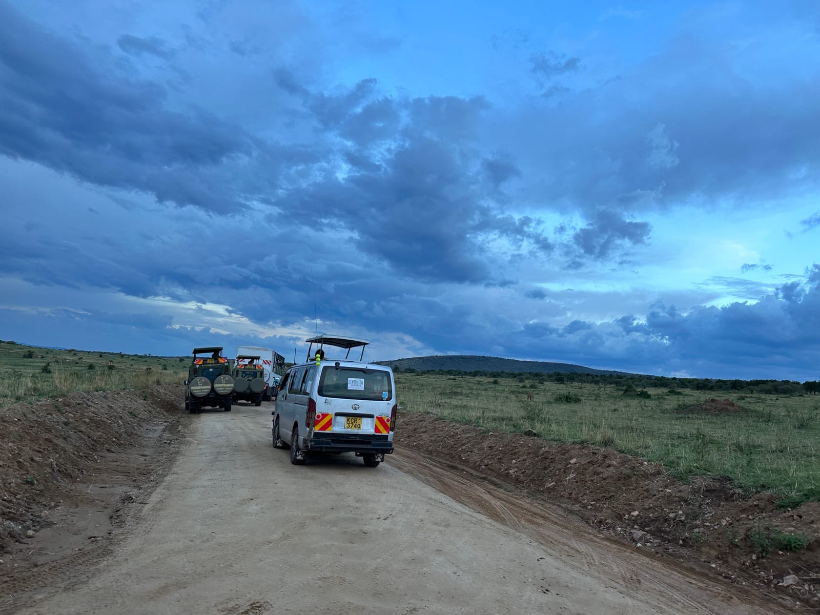 Safari vans on a dirt road in the Masai Mara National Reserve, Narok County, Kenya (file photo, 2023).