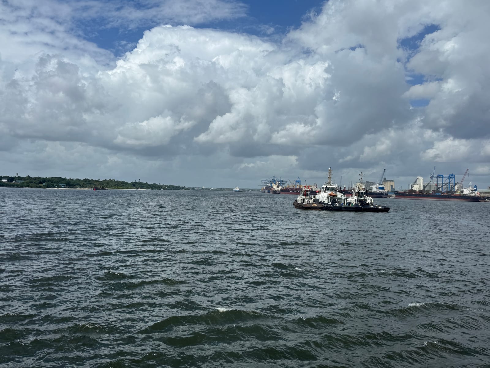 Boats in Dar es Salaam Harbour, with port cranes on the far shore (file photo, 2025).