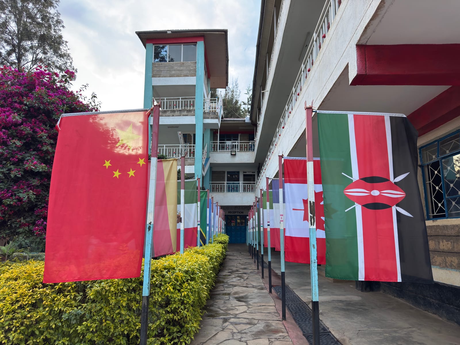 Chinese and Kenyan national flags hung along a walkway in a building complex in Roysambu, Nairobi (file photo, 2025).