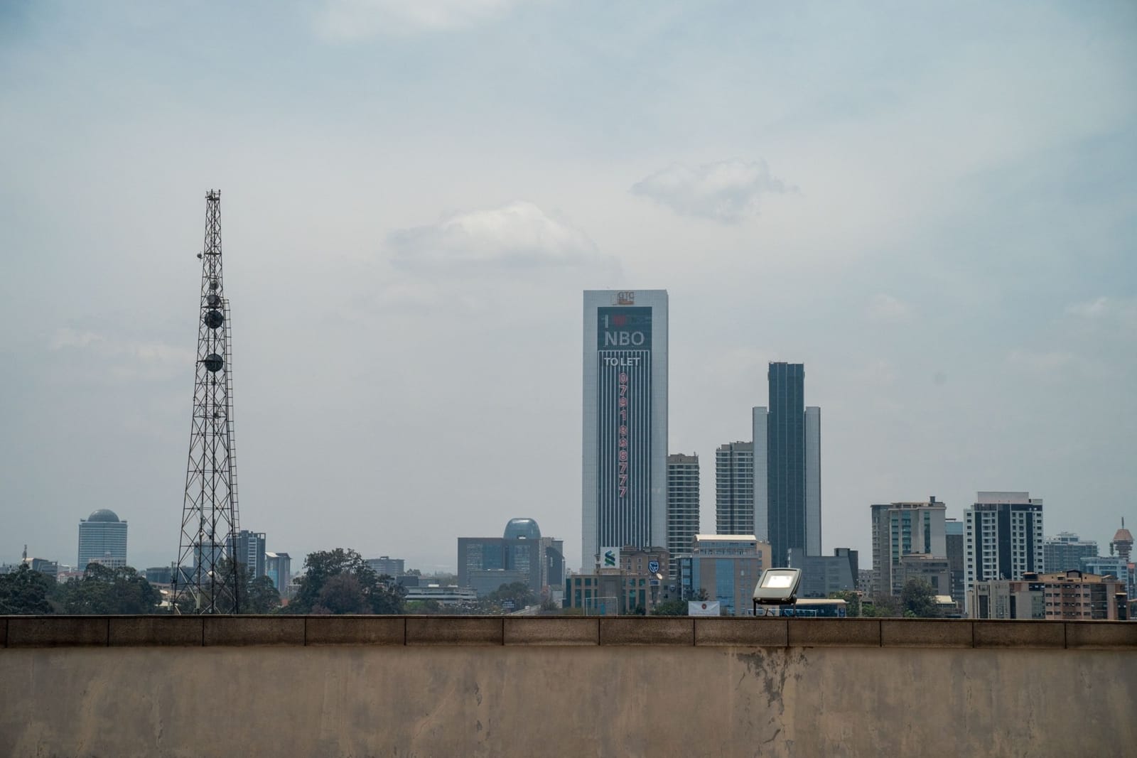 Office towers and a telecom mast on the Nairobi skyline on a hazy day (file photo, 2022).