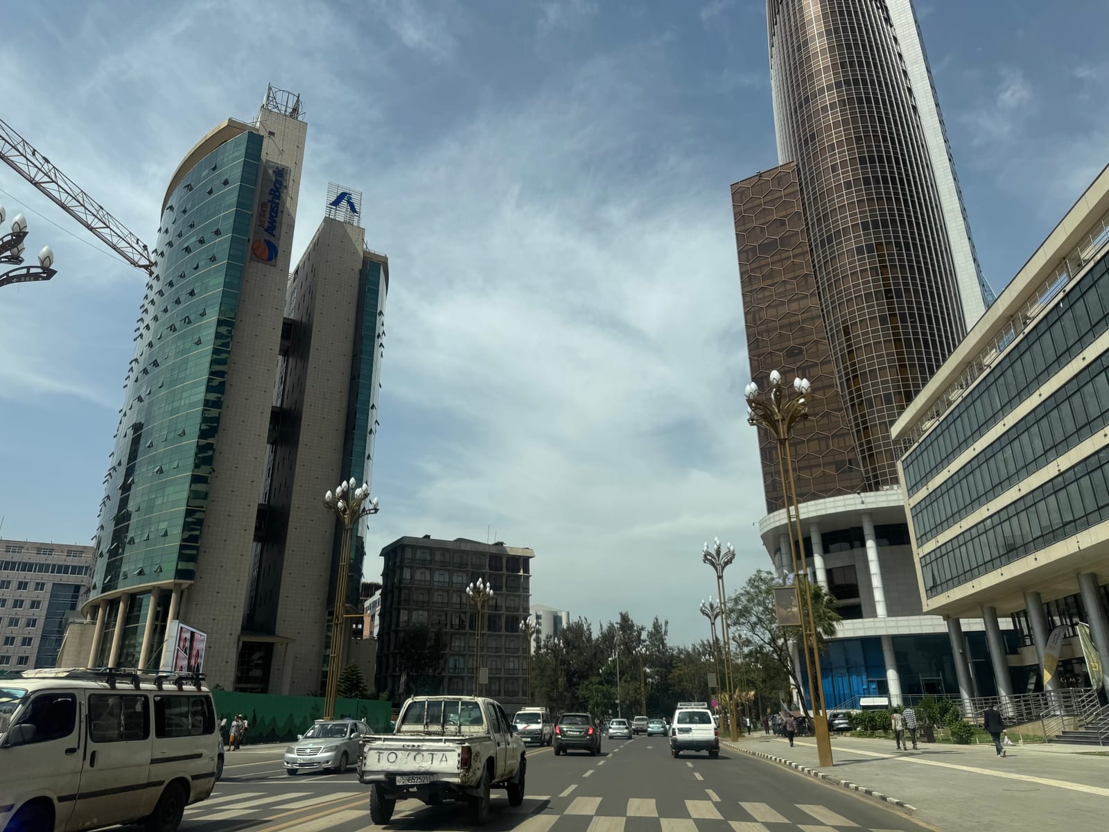 Glass high-rises and traffic on Ras Abebe Aregay Street in Lideta, Addis Ababa (file photo, 2025).