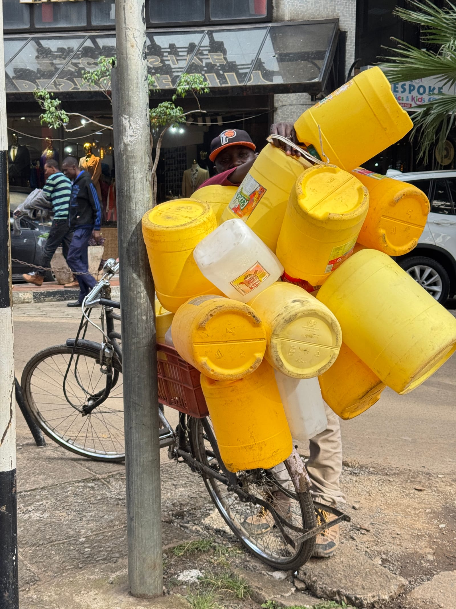 Yellow water jerrycans loaded on a bicycle in central Nairobi (file photo, May 2026).